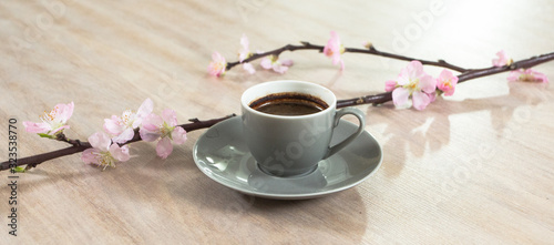 Fresh italian style coffee next to flower bouquet