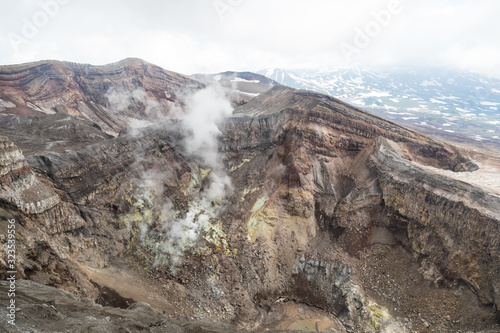 Gorely Volcano, Kamchatka Peninsula, Russia. An active volcano located in the south of Kamchatka. It consists of 11 cones and about 30 craters. Some craters are filled with acid or fresh water.