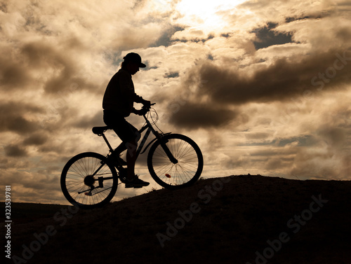 Silhouette of Mountain bike.Sport and healthy life.Extreme sports.Mountain bicycle and man.Life style outdoor extreme sport