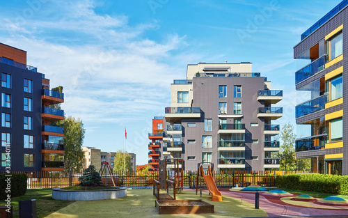 Quadro su tela Modern complex of apartment residential buildings and children playground