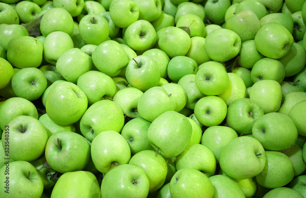 Fresh picked green apples background in the harvest season Fresh picked green apples background in the harvest season
