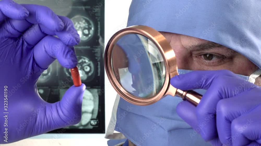  laboratory employee working on new medication project and studying pills