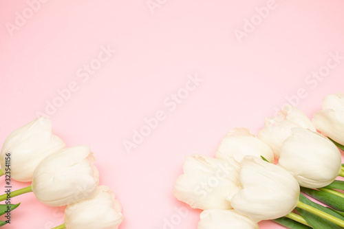 Spring background! Bouquet of white tulips on a pink background. Holiday Greeting Card for Valentine's Day, Women's Day, Mother's Day, Easter!