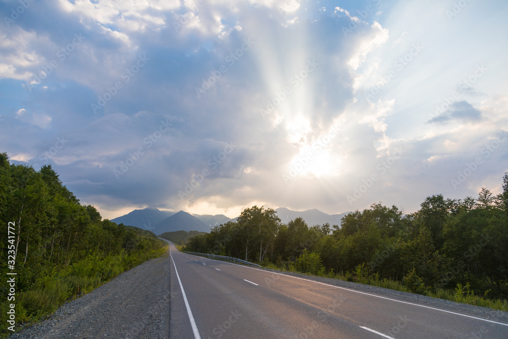 Road among the hills at sunset, Kamchatka Peninsula, Russia. Road among the hills at sunset, Kamchatka Peninsula, Russia.