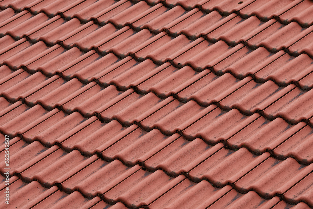 Details of the red tiles of a roof Details of the red tiles of a roof