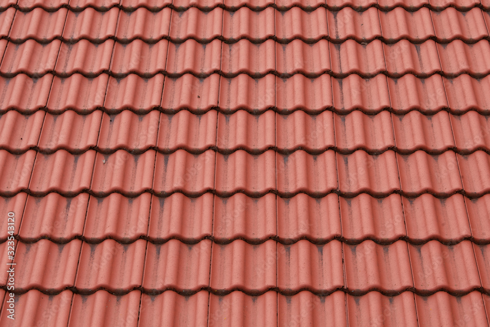 Details of the red tiles of a roof Details of the red tiles of a roof