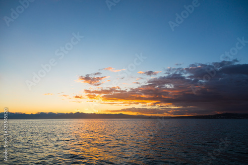Fototapeta Naklejka Na Ścianę i Meble -  Golden sunset in the sky over the Avacha Bay, Kamchatka Peninsula, Russia.