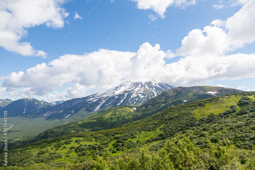 Vilyuchinsky volcano, Kamchatka peninsula, Russia. It is located southwest of the city of Petropavlovsk-Kamchatsky behind Avacha Bay. Vilyuchinsky volcano, Kamchatka peninsula, Russia. It is located southwest of the city of Petropavlovsk-Kamchatsky behind Avacha Bay.