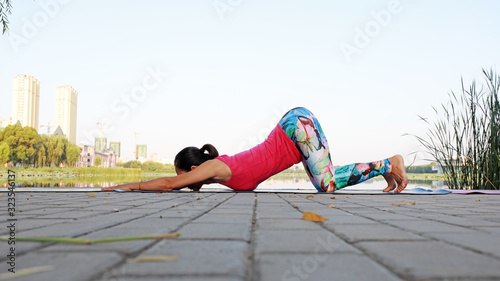 Ladies practice yoga in parks, Luannan County, Hebei Province, China