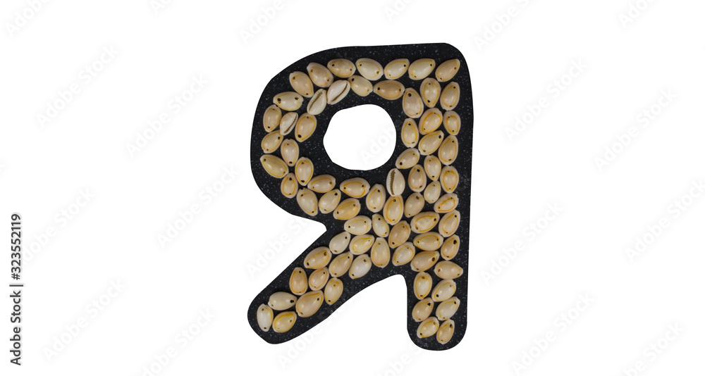 Isolated Font Russian Letter Я made of seashell on black granite on white background Isolated Font Russian Letter Я made of seashell on black granite on white background