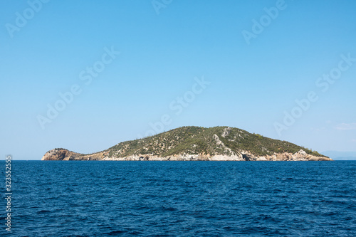 Rocky coast and gorgeous waters in Kelyfos islet, Marmaras, Chalkidiki, Greece © kokixx