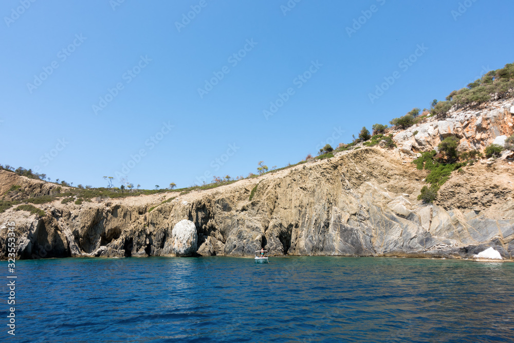 Rocky coast and gorgeous waters in Kelyfos islet, Marmaras, Chalkidiki, Greece