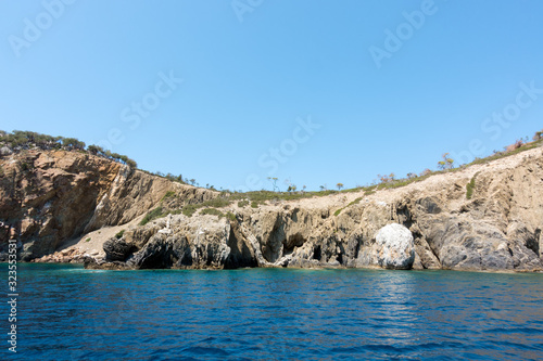 Rocky coast and gorgeous waters in Kelyfos islet, Marmaras, Chalkidiki, Greece