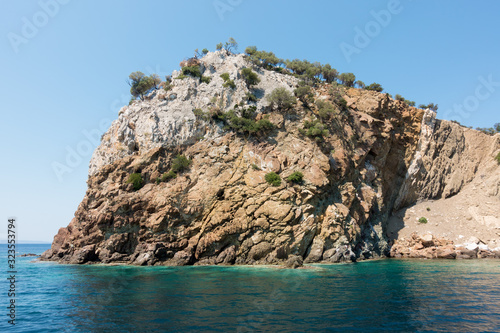 Rocky coast and gorgeous waters in Kelyfos islet, Marmaras, Chalkidiki, Greece photo