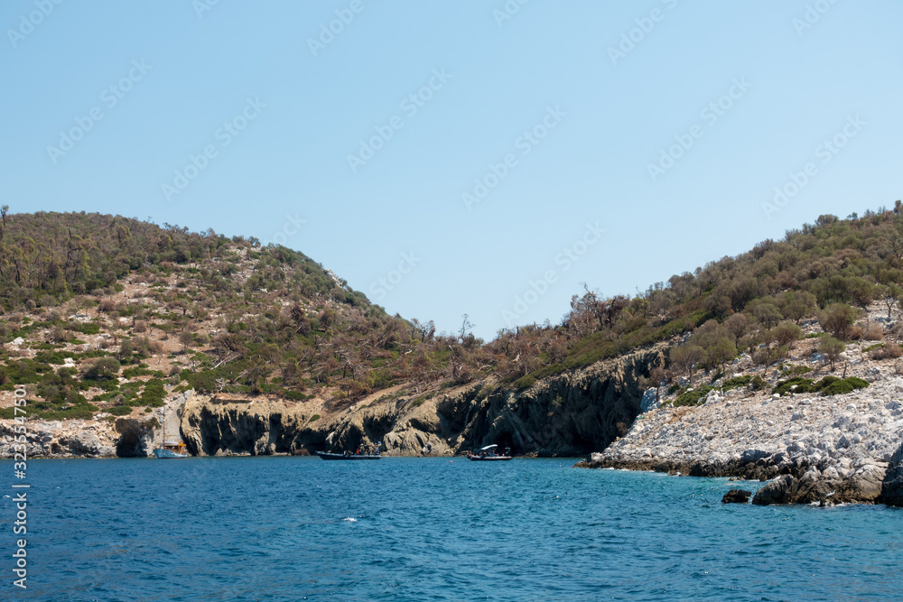 Rocky coast and gorgeous waters in Kelyfos islet, Marmaras, Chalkidiki, Greece
