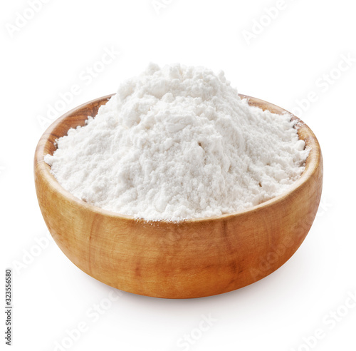 Gluten free flour. Wooden bowl of rice or wheat flour isolated on white background.