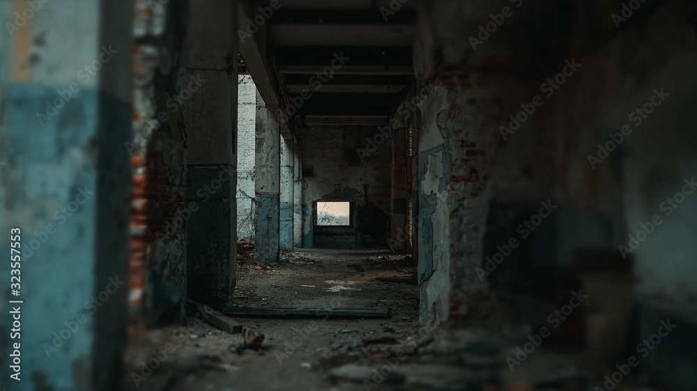 Long corridor of ruined abandoned eerie pillar industrial building with blurred vignette, vintage toned Long corridor of ruined abandoned eerie pillar industrial building with blurred vignette, vintage toned