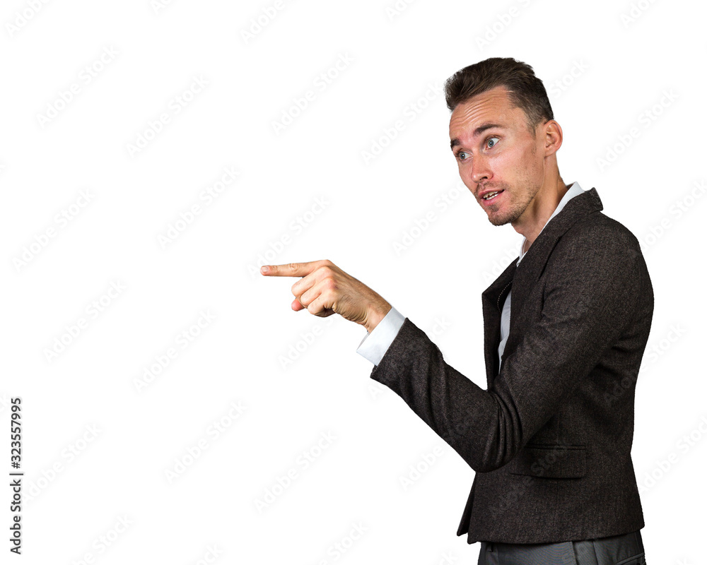 Adult businessman pointing aside and accusing empty space Adult businessman pointing aside and accusing empty space