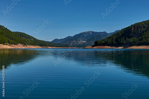 Lake between mountains and forests
