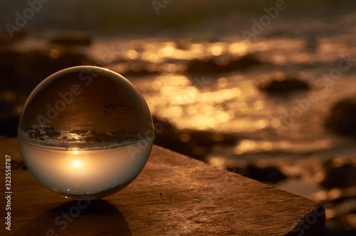 Sunrise in an Andalusian beach with a point of view from inside of a crystal ball