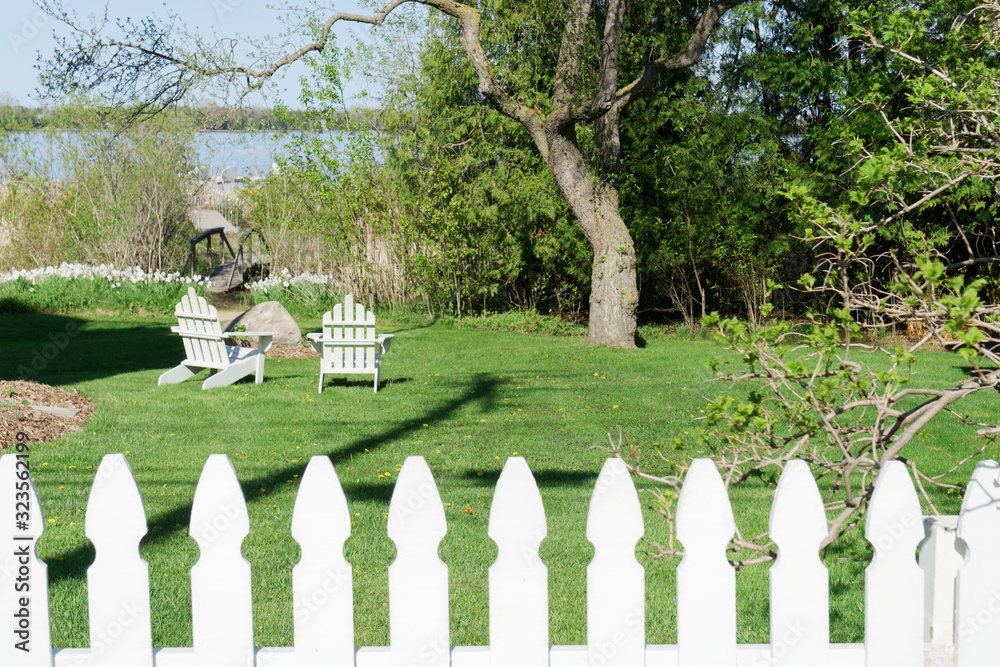 Picket Fence and Adirondack Chairs