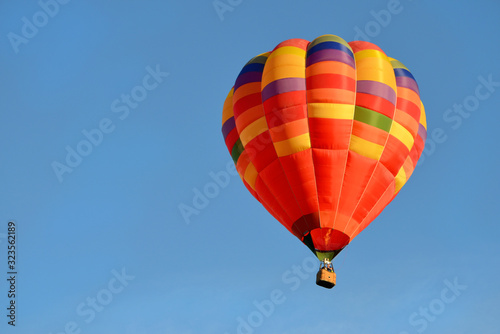 bright beautiful hot air balloon close up in the blue sky