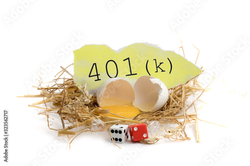 illustrating risk of losing to your Canadian Registered Retirement Savings Plan RRSP, a broken egg in a straw nest and text isolated on white photo