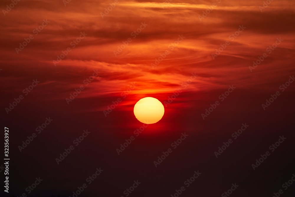 Sunset over between dark dramatic clouds