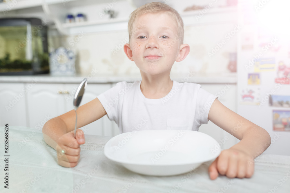the child has breakfast at the table the child has breakfast at the table