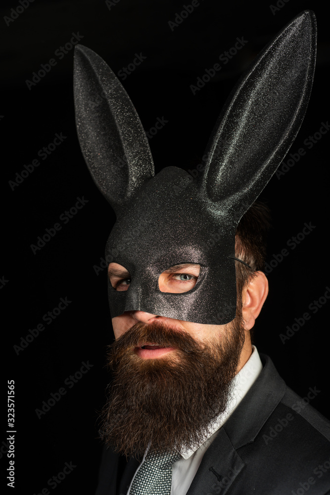 Handsome man with beard in playboy mask. Hipster with moustache. Handsome  stylish bearded man. Serious man with beard in rabbit mas. Brutal male.  foto de Stock | Adobe Stock