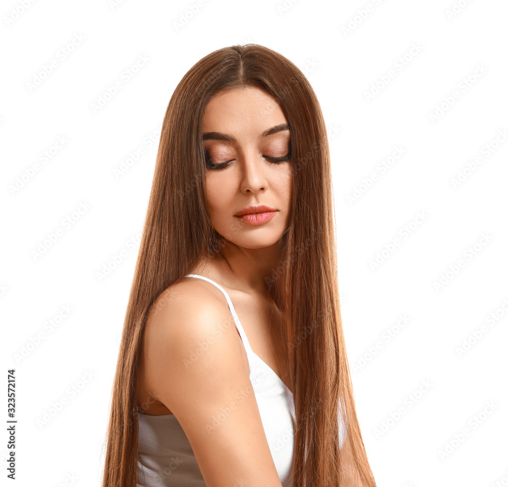 Fototapeta premium Beautiful woman with healthy long hair on white background