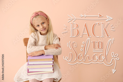 Little girl with books and ...