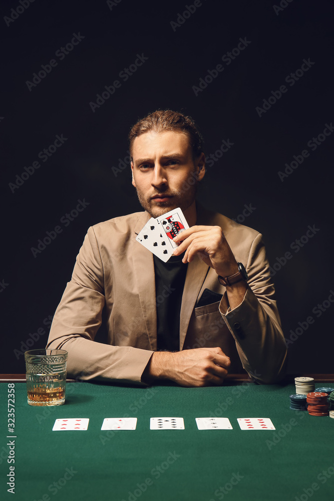 Fotografie Young man playing in casino