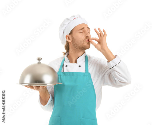 Happy male chef with tray a...