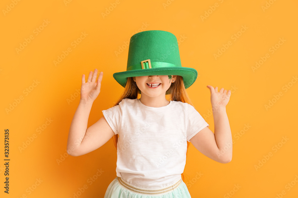 Funny little girl on color background. St. Patrick's Day celebration Funny little girl on color background. St. Patrick's Day celebration