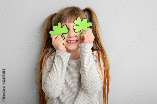 Funny little girl with clov...