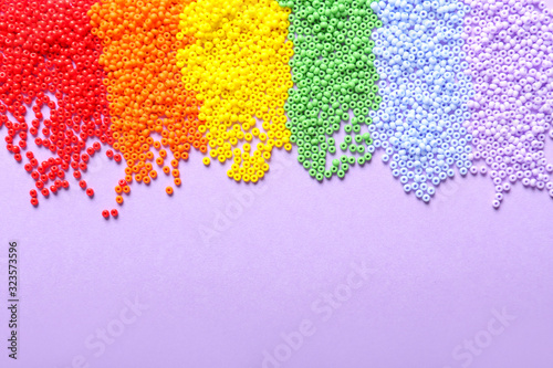 Fotografie, Obraz Many beads on color background. LGBT concept