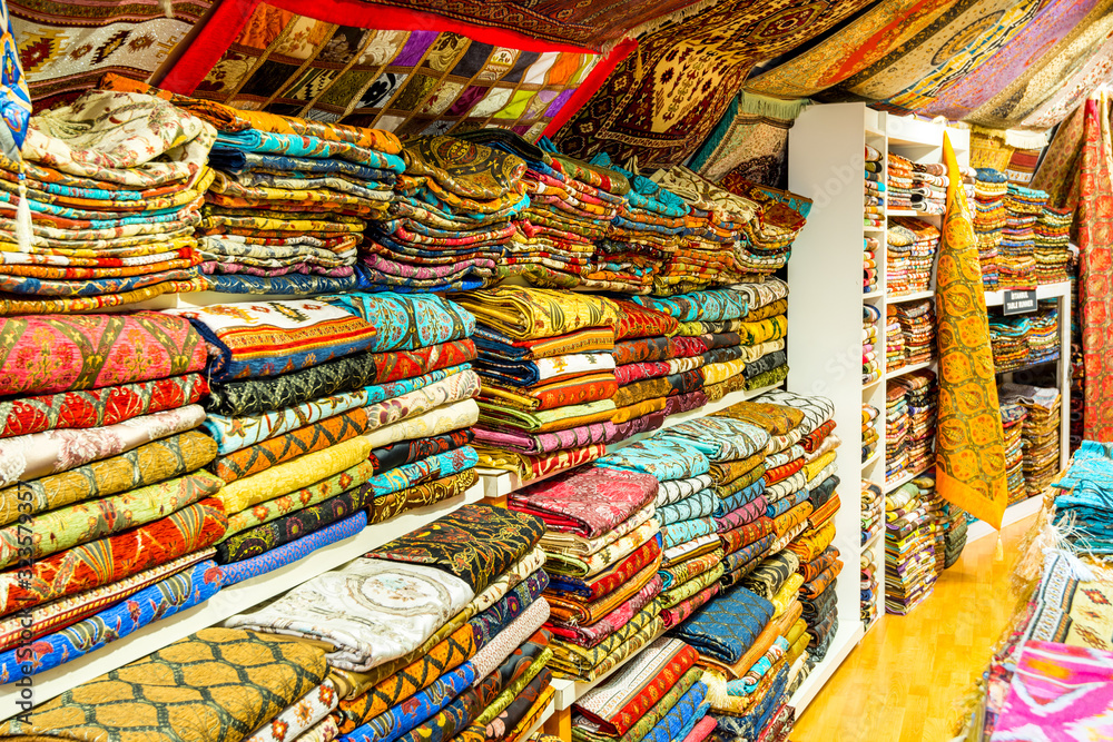 Colorful carpets and scarfs for sale at sevenirs shops in the Europe side of Istanbul, Turkey.