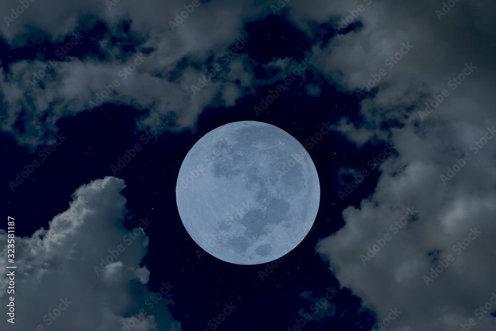 Full moon on night sky with blurred cloud.
