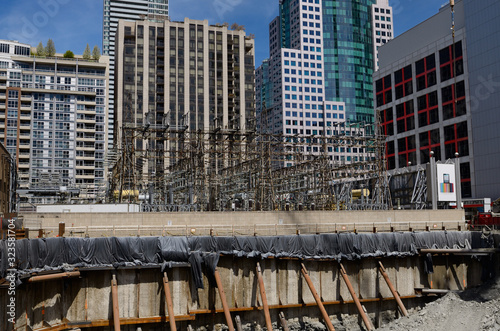 Photography Electrical substation surrounded by highrise towers and new development in downt
