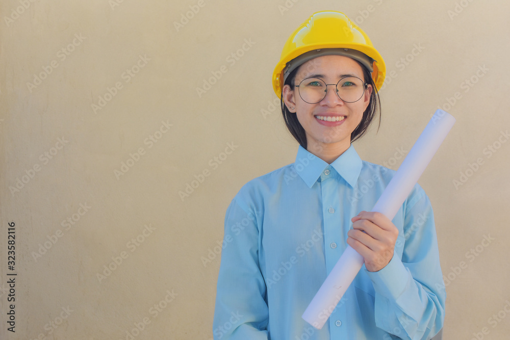 Woman holding Blueprint Helmet hard hat Foreman Building construction estate development concept Woman holding Blueprint Helmet hard hat Foreman Building construction estate development concept