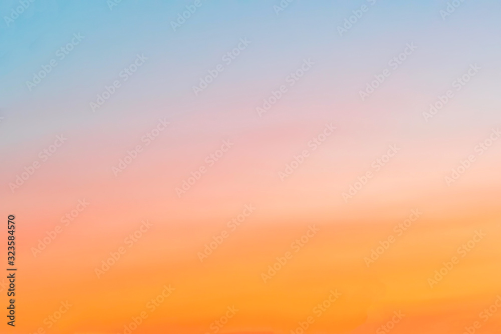 clear sky with a smooth orange-blue gradient. Sunset