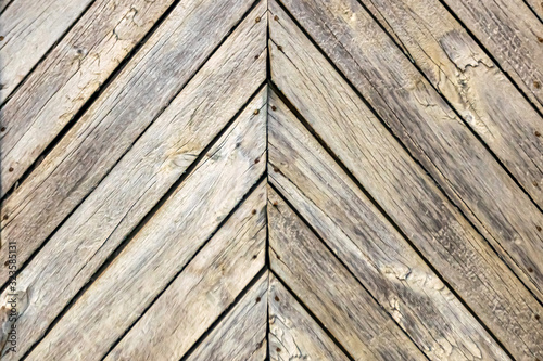 Wooden unpainted boards. Herringbone. Close-up. Background. Texture.