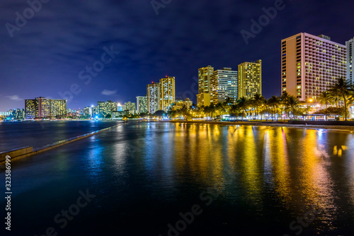 Fantastic view of tropical city at night in Honolulu  Hawaii  USA
