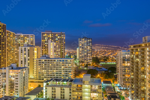 Night view nature and cityscape concept: evening outdoor urban view of modern real estate city in Honoluu, Hawaii.