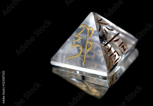 Crystal in Pyramid Shape With REIKI symbols : Cho Ku Rei means Power, Sei Hei ki means Harmony, Hon sha ze sho nen means Distance, Dai ko myo means Master, Raku =completion photo