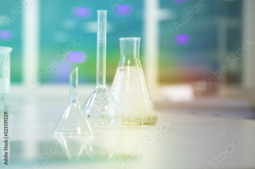 Colourful glass bottles for lab procedures bottles and flasks. essentia oils products-treatment medical 