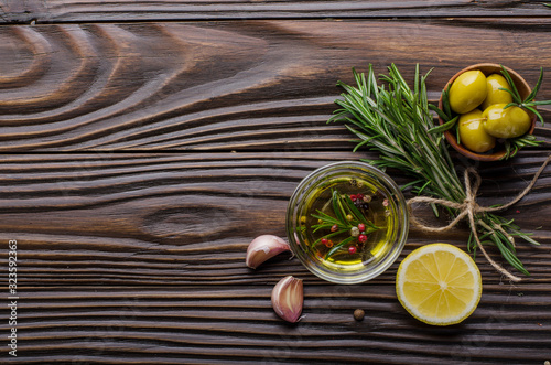 Flat lay Food background frame made of oils condiments and spices on kitchen table. Cooking concept with copy-space