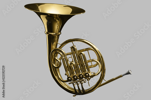 French Horn over light grey plain background photo