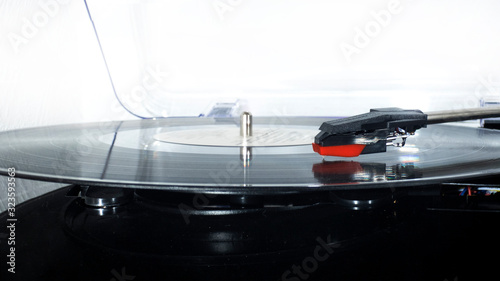 Vinyl turntable on a white background. Retro audio equipment for vinyl disk.